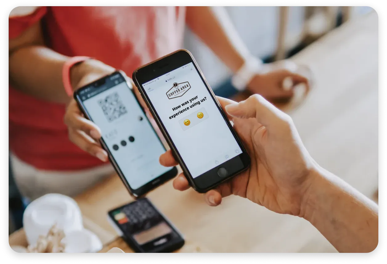 A mock showing a Voyce Feedback QR code embedded in an iOS app being used by front-of-house staff.